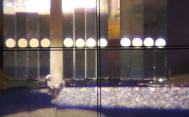 2017/01 - The 3 sets of 4 images (one set per fiber) aligned on the mirror stack, and acting as a 1.5-mm spectrograph slit (with the crosshair serving as an external aligning reference). Each thin mirror of the stack is tilted so as to redirect the pupil sector of each beam onto the spectrograph grating (© Winlight Optics)