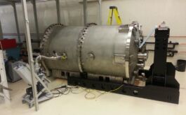 2015/09 - External support frame (ESF) assembled and positioned and cryostat uncrated and placed between the rails on blocks, awaiting rails (©SPIRou team)