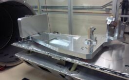 2016/03 - Spectrograph optical bench mounted on the internal support frame of the cryogenic vessel through the cold plate, with optical mounts currently holding dummy optics. The slidable part of the vessel is visible on the left side (©NRC-H, Victoria)